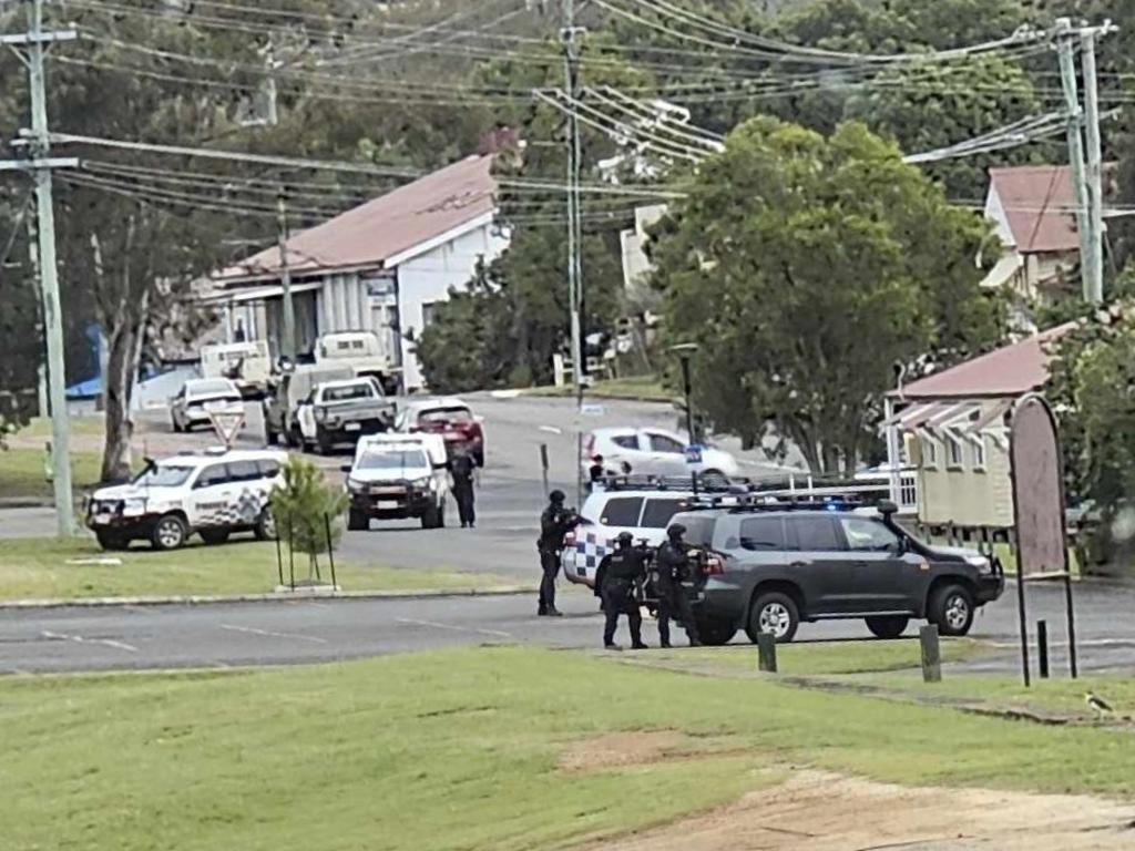 Police had their weapons drawn during an early morning raid in Nanango on Wednesday. Photo: Leisa Green.