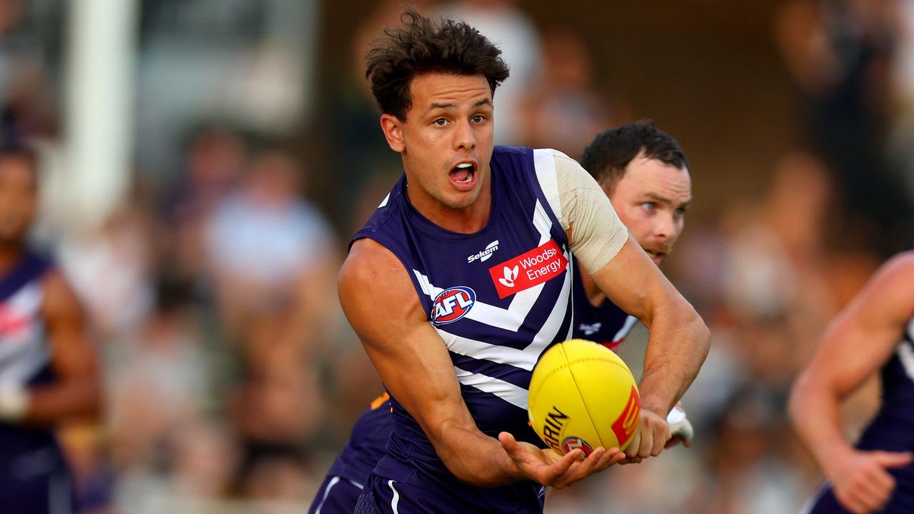 Heath Chapman of the Dockers handballs the ball away during the AFL Practice Match between the Fremantle Dockers and the Port Adelaide Power at Fremantle Oval on March 02, 2023 in Perth, Australia. (Photo by James Worsfold/AFL Photos/via Getty Images)