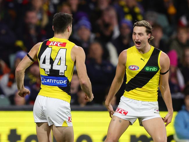 Seth Campbell of the Tigers celebrates a goal with Tyler Sonsie. (Photo by Sarah Reed/AFL Photos via Getty Images)