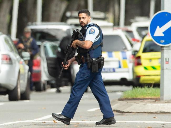 An armed police officer patrols the streets following the Christchurch massacre mosque shooting in 2019. Picture: Martin Hunter/AAP Image/SNPA