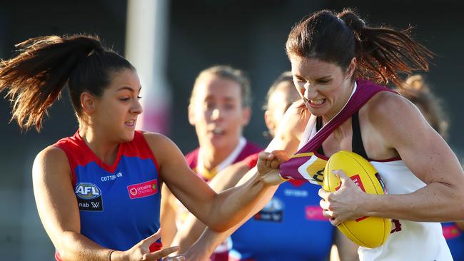 Lions debutant Jessy Keeffe tries to break the tackle of Bulldog Monique Conti. Picture: Getty Images