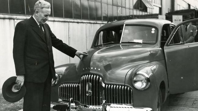 Manufacturing behind high tariff walls was a key part of the post-war recovery plan. Ben Chifley inspects the first Holden 48-215. Picture: NCA Newswire.