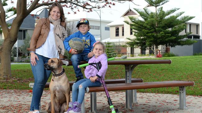 North Coogee resident Lucy Gibson with children Nathan, 8, and Annabelle, 5, and their dog Max. The last Census revealed their suburb is the fastest growing.