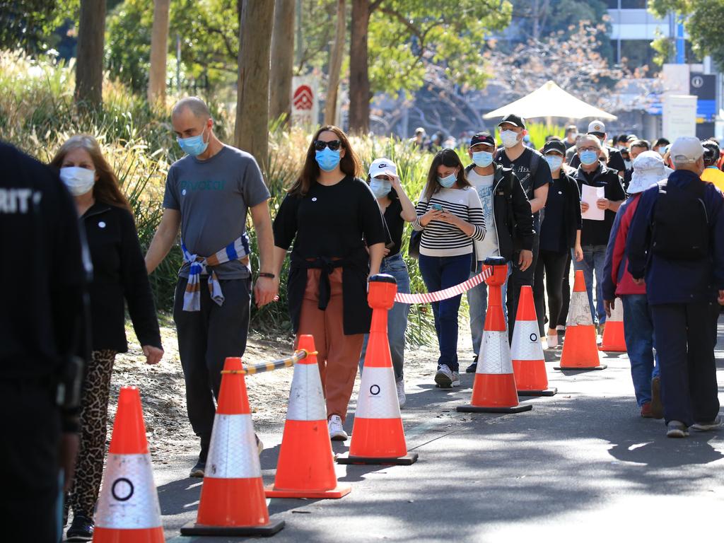 People are seen queued to receive their vaccination at the NSW Vaccine Centre at Homebush Olympic Park in Sydney. Picture: NCA NewsWire/Christian Gilles