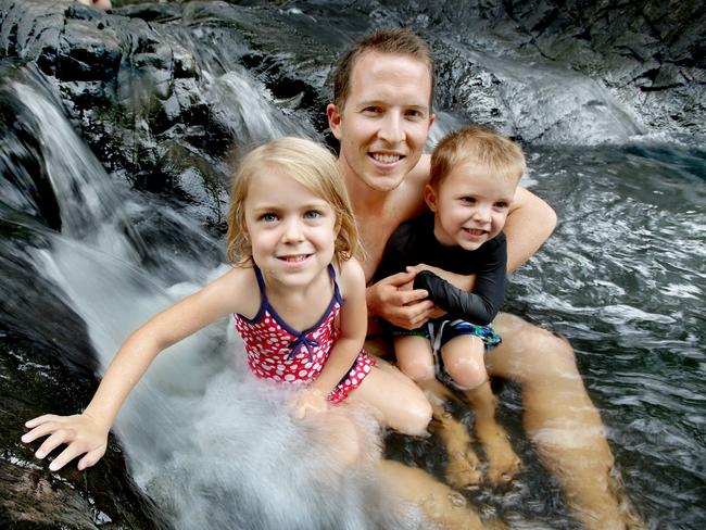 Travis Hunt and Kids Indiana, 4, and Phoenix, 3, from Victoria Point cool off at Currumbin Valley Rock Pools. Pic by Luke Marsden. 