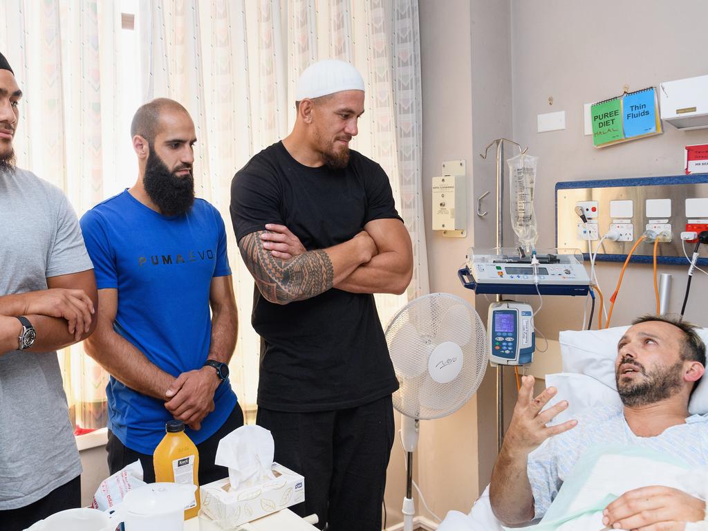 He was visited in hospital by All Blacks Rugby Stars Ofa Tu'ungafasi (L) and Sonny Bill Williams (R) and AFL player Bachar Houli of the Richmond Tigers. Picture: Kai Schwoerer/Getty Images.