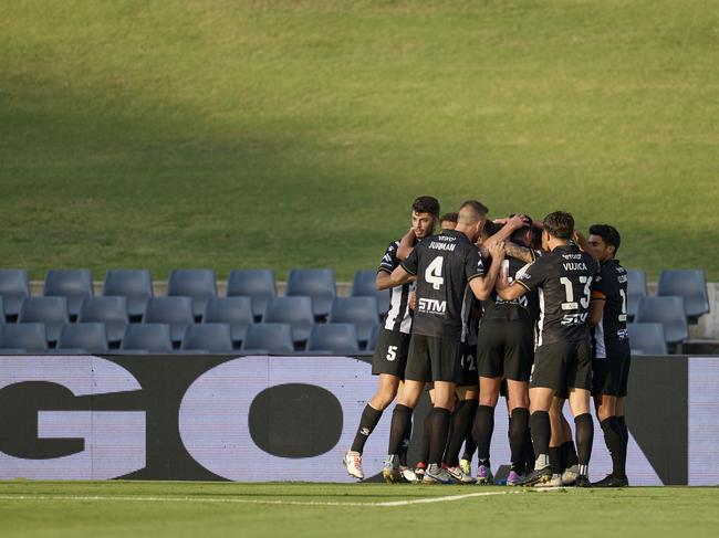 SYDNEY, AUSTRALIA - DECEMBER 04: Valere Germain of Macarthur FC celebrates scoring a goal with team mates during the A-League Men round six match between Macarthur FC and Adelaide United at Campbelltown Stadium, on December 04, 2023, in Sydney, Australia. (Photo by Brett Hemmings/Getty Images)