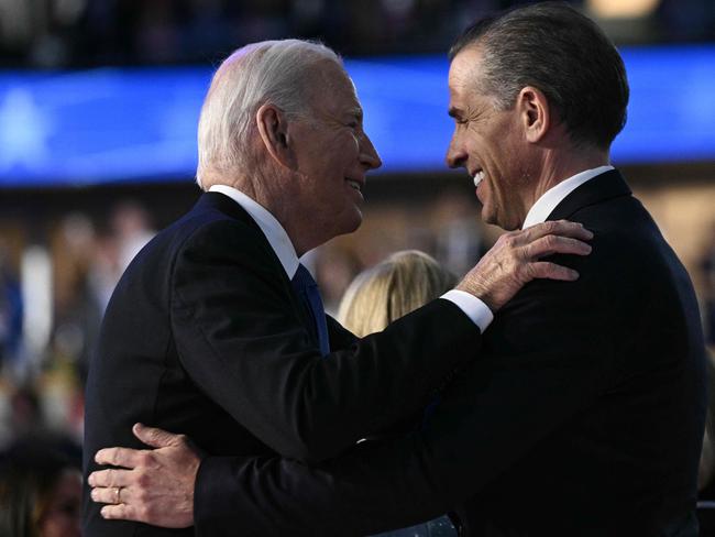 (FILES) US President Joe Biden and his son Hunter Biden hug on stage at the conclusion of the first day of the Democratic National Convention (DNC) at the United Center in Chicago, Illinois, on August 19, 2024. US President Joe Biden has signed a pardon for his son Hunter Biden, according to a statement issued on December 1, 2024. (Photo by Brendan SMIALOWSKI / AFP)