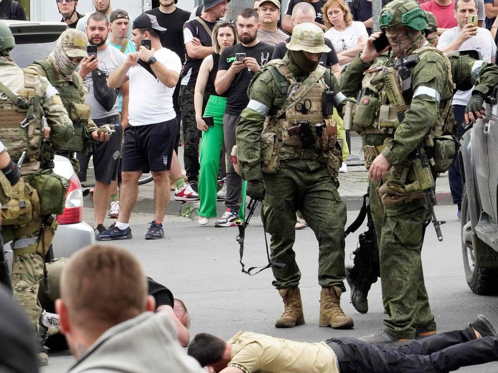 Members of Wagner group detain a man in the city of Rostov-on-Don, on June 24. Picture: Handout / AFP