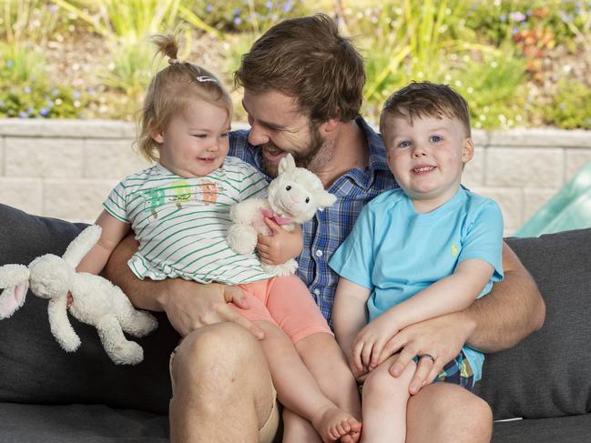 Adam Robinson, 32, with 18-month-old Ailish and three-year-old Cian. Adam plans to provide a saliva sample for the world’s largest genetic study of skin cancer that’s been launched in Queensland. Picture: Richard Walker, AAP.