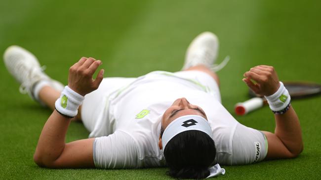 Ons Jabeur of Tunisia falls to the floor against Aryna Sabalenka in their semi-final. Picture: Mike Hewitt/Getty Images