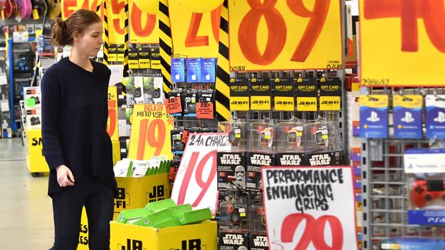 A customer is seen inside a JB Hi-Fi store in Brisbane, Monday, August 13, 2018. JB Hi-Fi's full yet net profit jumps 35 per cent to $232.2 million, thanks to strong demand for its consumer electronics. (AAP Image/Darren England) NO ARCHIVING