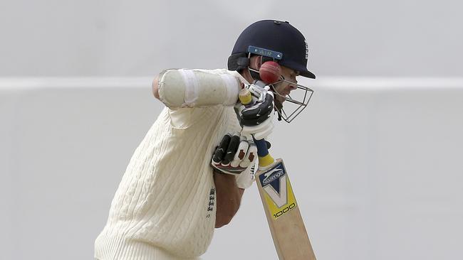 England's James Anderson is hit on the helmet by Australia's Pat Cummins.