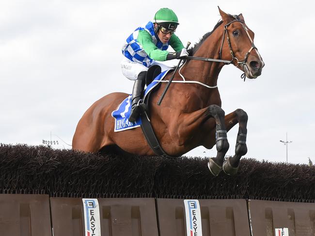 Stern Idol (IRE) ridden by William McCarthy clears a steeple on the way to winning the J.E.H Spencer Memorial Steeplechase at Sportsbet Pakenham on April 14, 2024 in Pakenham, Australia. (Photo by Pat Scala/Racing Photos via Getty Images)