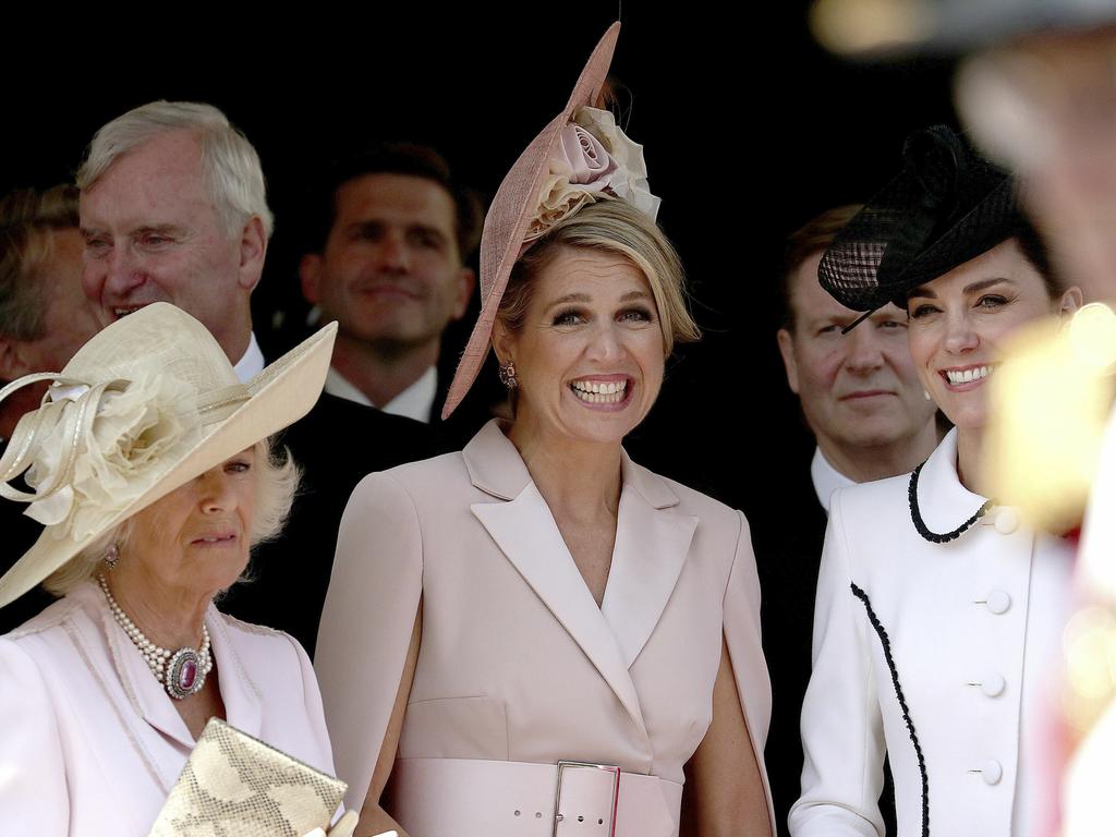 Queen Maxima (centre) was given a firm tap by Prince Charles’ wife who was keen to see them keep to the schedule at St George’s Chapel in Windsor. Picture: AP