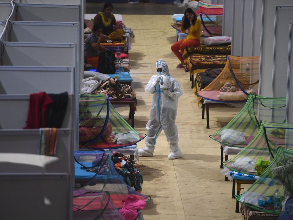 A health worker with coronavirus patients inside a converted COVID facility in New Delhi. Picture: Tauseef Mustafa/AFP