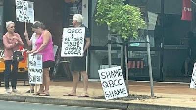 Christine and Leonard Wade protested with a small group of family and friends outside Kerry Campbell Homes on the Esplanade, Hervey Bay on Monday, October 17.