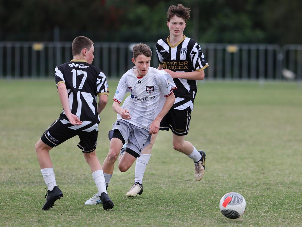 Premier Invitational Football 2024 tournament at Glennon Park Nerang. Field 5...Willowburn (black stripes) V Caboolture. Picture Glenn Hampson