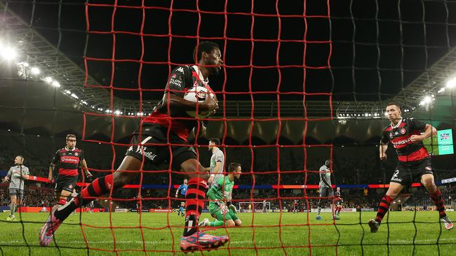 Wanderers’ Bruce Kamau grabs the ball from the back of the net after scoring one of his two goals against Central Coast at Bankwest Stadium. Picture: Getty Images