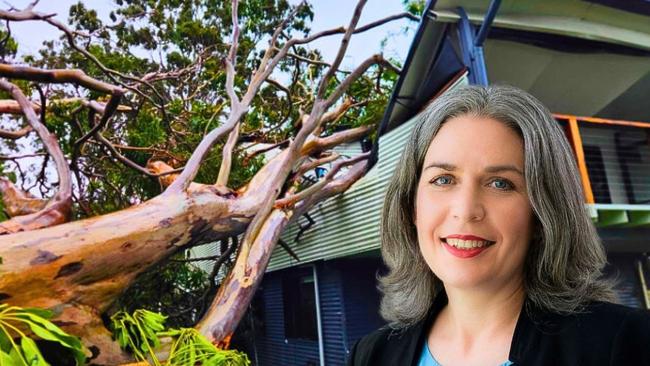 Arca chief executive Elsa Markula in front of a Redland Bay home destroyed after a massive gum crashed through its roof. Pictures: JUDITH KERR