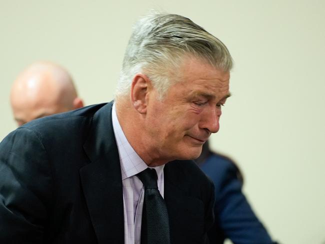 TOPSHOT - US actor Alec Baldwin gets emotional at the conclusion of his trial on involuntary manslaughter at Santa Fe County District Court in Santa Fe, New Mexico, on July 12, 2024. Baldwin's trial for involuntary manslaughter was dismissed by a judge Friday after she ruled that key evidence over a fatal shooting on the set of "Rust" had been withheld from the defense. (Photo by RAMSAY DE GIVE / POOL / AFP)