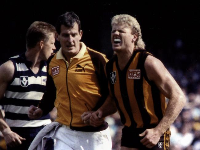 WARNING! HERALD SUN ONLY. DO NOT RUN. Dermott Brereton grimaces in pain during the 1989 Grand Final against Geelong. Picture: Supplied