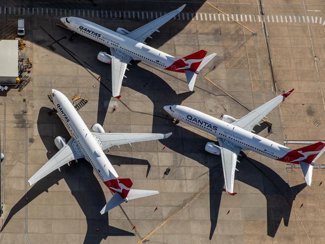 SYDNEY, AUSTRALIA - APRIL 22: Qantas planes are parked on the tarmac at Sydney Airport on April 22, 2020 in Sydney, Australia. Restrictions have been placed on all non-essential business and strict social distancing rules are in place across Australia in response to the COVID-19 pandemic.  (Photo by Cameron Spencer/Getty Images)