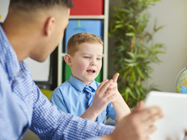 schoolboy with trainee teacher Picture: Istock