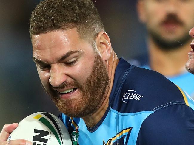 GOLD COAST, AUSTRALIA - JULY 15:  Brenko Lee of the Titans is tackled during the round 18 NRL match between the Gold Coast Titans and the Sydney Roosters at Cbus Super Stadium on July 15, 2018 in Gold Coast, Australia.  (Photo by Chris Hyde/Getty Images)