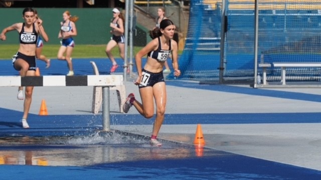 Zara Moore and Selwyn Russell of Brisbane State High School in the Steeple Chase event.