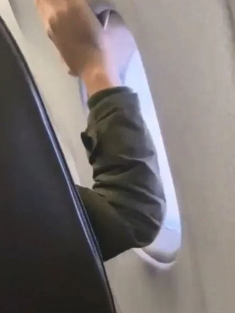 But the flyer next to the window is having none of it. Picture: Passenger Shaming