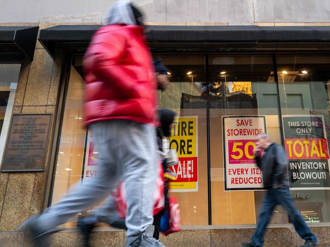 NEW YORK, NEW YORK - JANUARY 13: People walk by a Macy's store in Brooklyn after the company announced it was closing the store along with over 60 others on January 13, 2025 in New York City. Macy's, once the nation's premier department store, has struggled in recent years with the competition from online retailers and discount stores such as Walmart. Macy's has said that the closures would allow them to prioritize its roughly 350 Macyâs remaining locations.   Spencer Platt/Getty Images/AFP (Photo by SPENCER PLATT / GETTY IMAGES NORTH AMERICA / Getty Images via AFP)