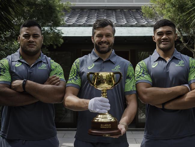 Wallabies (from left to right) Taniela Tupou, Adam Ashley-Cooper and Jordan Uelese pose with the Melbourne Cup in Tokyo. Picture: Nicolas Datiche