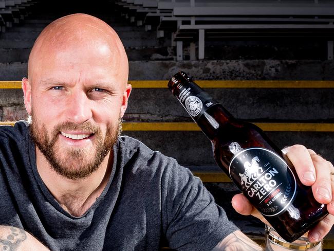 CUB are launching a non-alcoholic beer called Carlton Zero. Melbourne captain Nathan Jones is celebrating the Dee's first finals appearance in a long time by enjoying one of the new beers. Picture: Jake Nowakowski