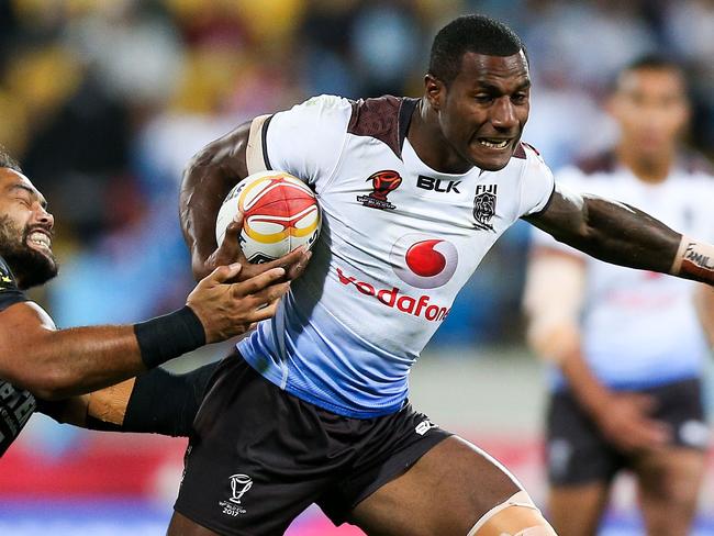 WELLINGTON, NEW ZEALAND - NOVEMBER 18:  Suliasi Vunivalu of Fiji breaks the tackle of Adam Blair of the Kiwis during the 2017 Rugby League World Cup Quarter Final match between New Zealand and Fiji at Wellington Regional Stadium on November 18, 2017 in Wellington, New Zealand.  (Photo by Hagen Hopkins/Getty Images)