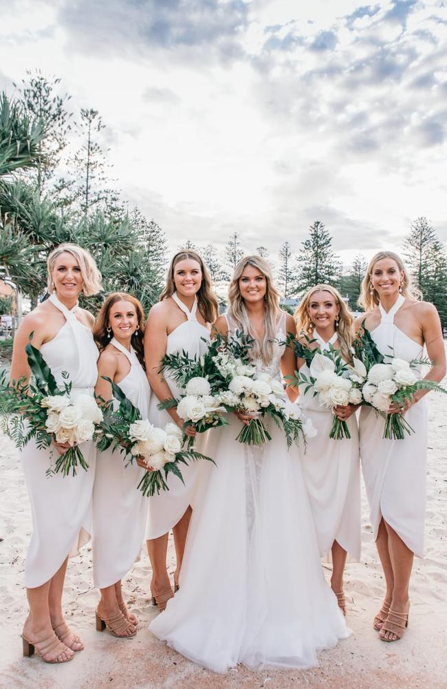 Former teammates Clare McMeniman (far left) and Laura Geitz (far right) were among Tippett’s bridal party