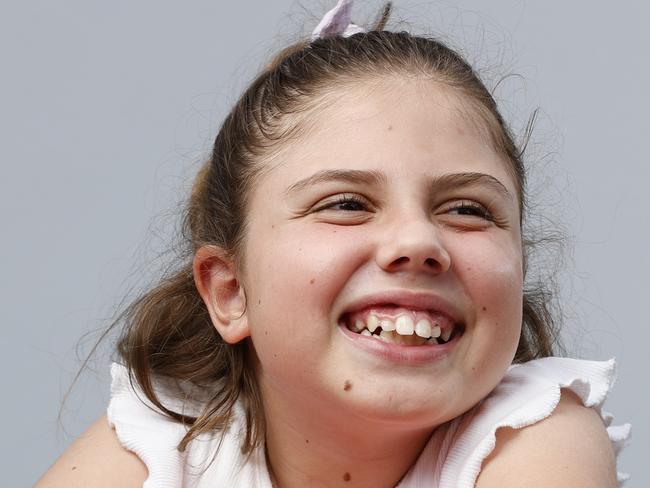 10 year old self confessed bookworm Eva Garcia who suffers from Cortical Visual Impairment and volunteers her time for Braille House who this year are celebrating their 125th anniversary. Picture Lachie Millard