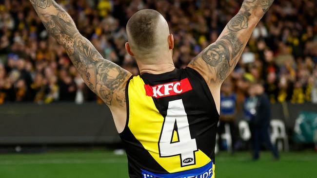 MELBOURNE, AUSTRALIA - JUNE 15: Dustin Martin of the Tigers recognises the crowd after his 300th match during the 2024 AFL Round 14 match between the Richmond Tigers and the Hawthorn Hawks at The Melbourne Cricket Ground on June 15, 2024 in Melbourne, Australia. (Photo by Michael Willson/AFL Photos via Getty Images)