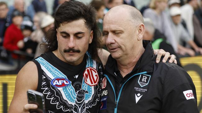 MELBOURNE, AUSTRALIA - MAY 28: Lachie Jones of the Power and Port Adelaide Senior Coach, Ken Hinkley are seen after the round 11 AFL match between Richmond Tigers and Yartapuulti / Port Adelaide Power at Melbourne Cricket Ground, on May 28, 2023, in Melbourne, Australia. (Photo by Darrian Traynor/AFL Photos/via Getty Images)