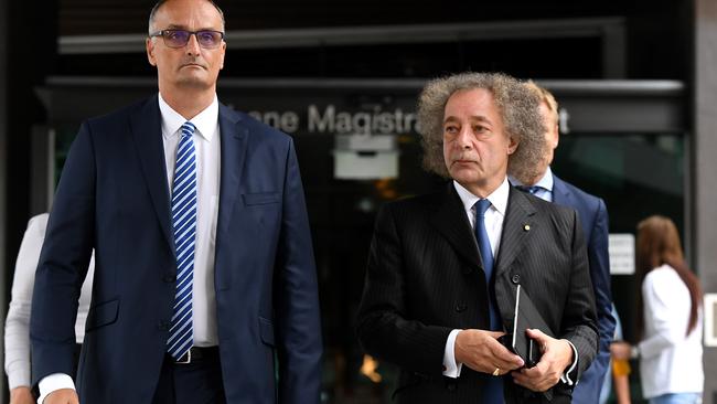 Ardent Leisure CEO John Osborne (left) and Chairman Gary Weiss leave the Magistrates Court in Brisbane yesterday. Picture: AAP