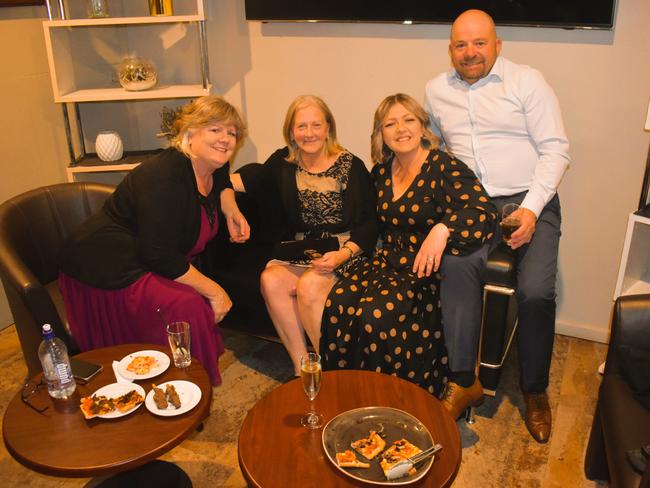 Genevieve Edebohls, Julie Cooper, Jo Lay and Roger Farley having a great night at the Cowwarr Saints Football &amp; Netball Club Golden Gala Ball 2024. Picture: Jack Colantuono