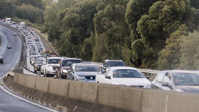 South-bound traffic banking up on the Southern Outlet after a single-vehicle accident in the wet weather. Picture: MATHEW FARRELL