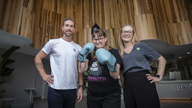 Exercise physiologist Josh Miller, coach Ella Crocombe and St. Lukes Health Southern Regional Manager Kate Denmen in the wellbeing hub at Hobart. Picture: Chris Kidd