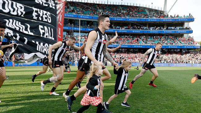 Jack Crisp, with his daughters before his 200th game, is a two-time winner of Collingwood’s Copeland Trophy. Picture: Getty Images