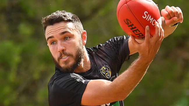 GOLD COAST, AUSTRALIA - SEPTEMBER 11: Shane Edwards of the Tigers handballs whilst being tackled during his period in the AFL quarantine hub at the Mercure on September 11, 2020 in Gold Coast, Australia. (Photo by Quinn Rooney/Getty Images)