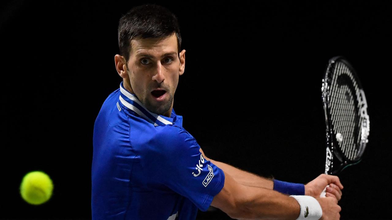 Djokovic can expect a frosty reception at the Australian Open. (Photo by OSCAR DEL POZO / AFP)