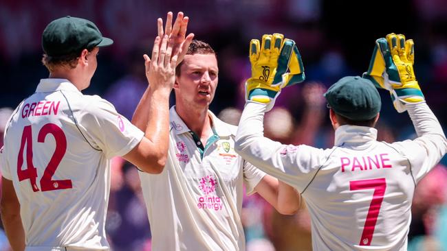 Australia's Josh Hazlewood, centre, celebrates with teammates after taking the wicket of India's Rishabh Pant (not pictured) during day three of the third cricket Test match between Australia and India at the Sydney Cricket Ground. Picture: David Gray/AFP