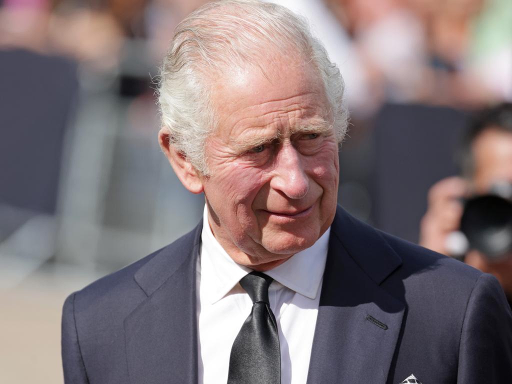 King Charles III views floral tributes to the late Queen Elizabeth II outside Buckingham Palace. Picture: Getty Images.