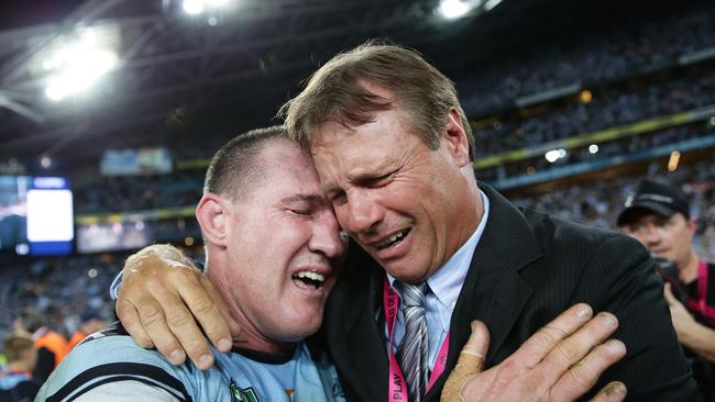 Shark's Paul Gallen and Andrew Ettingshausen celebrate the Sharks win of the 2016 NRL Grand Final between the Cronulla Sharks and Melbourne Storm at ANZ Stadium, Sydney. Picture: Brett Costello