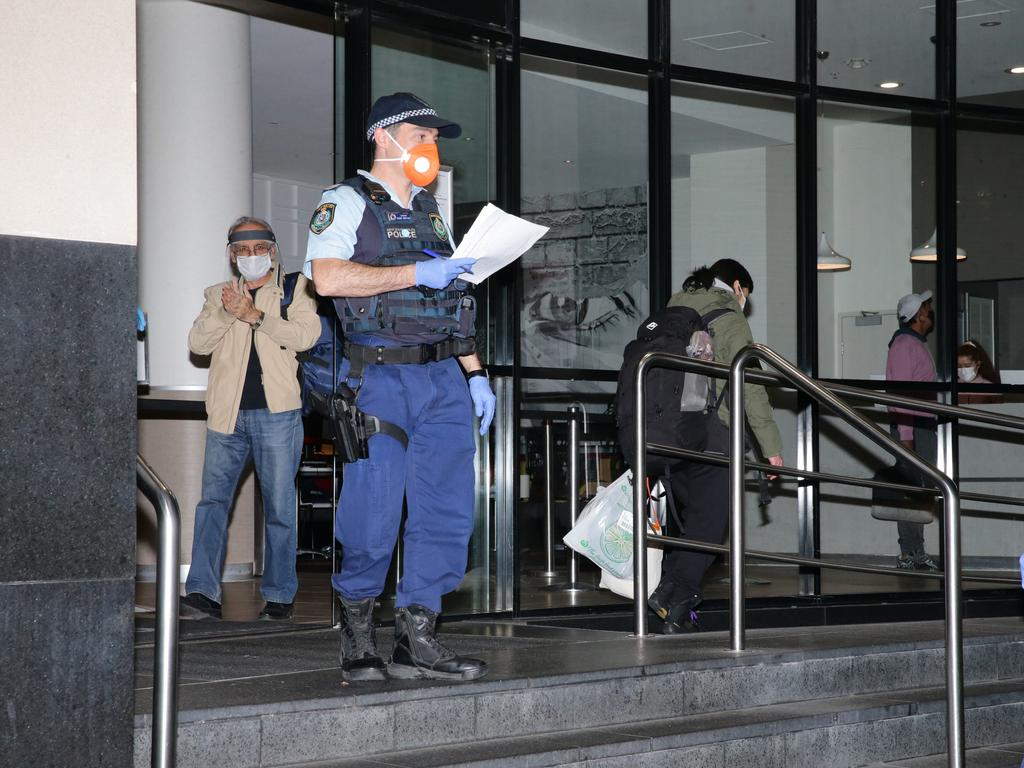 Police moving travellers out of the Travelodge in Surry Hills. Picture: Bill Hearne